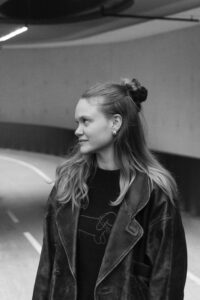 Young woman looking to the left and smiling